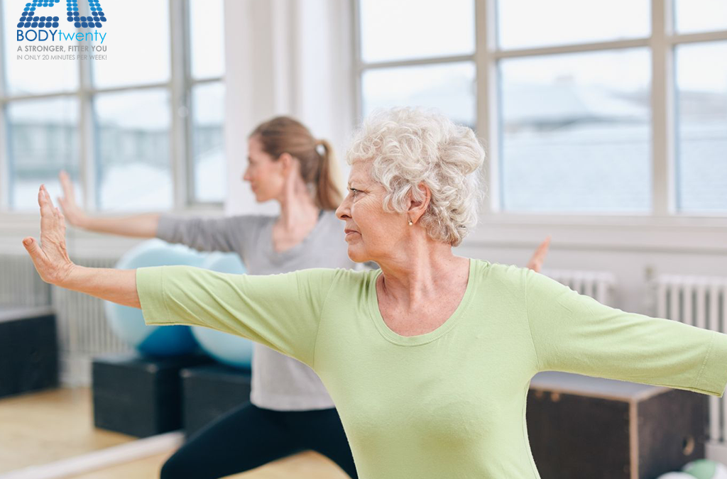 Old woman exercising in studio