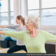 Old woman exercising in studio