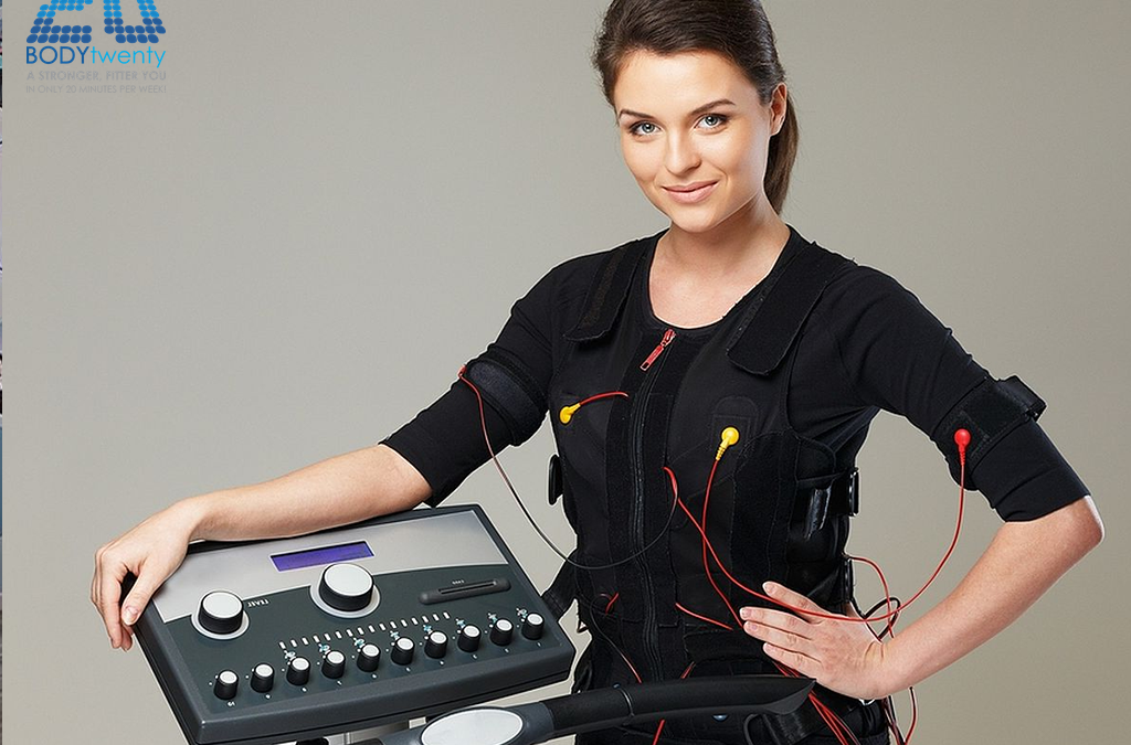 Woman standing next to EMS machine